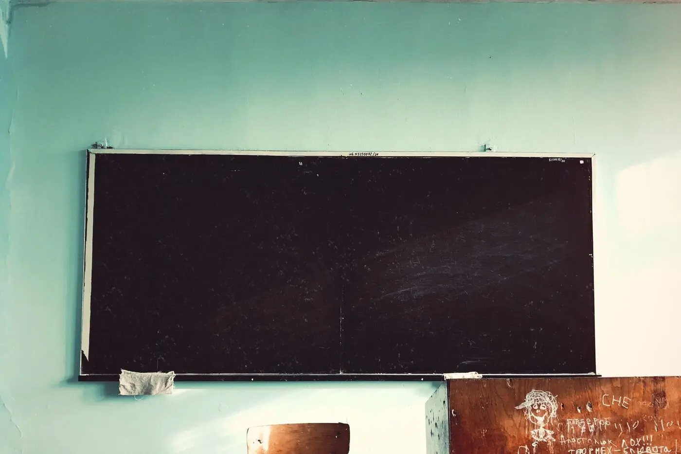An old classroom with an empty blackboard